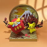 Two cartoon characters on a decorative stand with a mountain and cherry blossoms background.