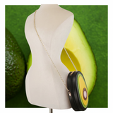 Avocado Slice Crossbody worn with gold-tone chain strap