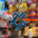 Handcrafted blue glass bead snowflake charm made by a local artist