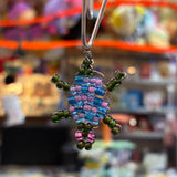 Handcrafted glass bead turtle charm made by a local artist