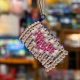 Handcrafted pink and clear glass bead diamond charm made by a local artist