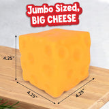 Squeezy Cheese Block squishy toy shown next to packaging for size